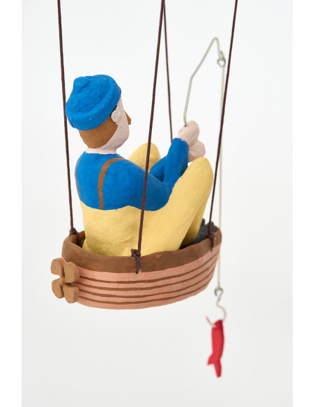  Pescador con pez azul 